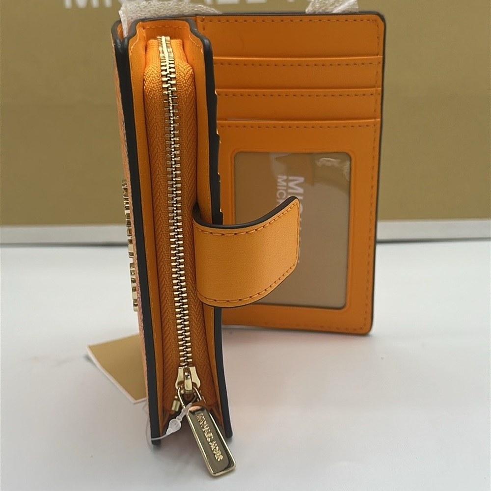 Michael Kors Jet Set Travel Medium Printed Signature Logo Bi-Fold 
Pop Orange - Picture 6 of 14